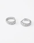 Load image into Gallery viewer, A pair of 14mm 925 Sterling silver huggie hoop earrings set with clear pavé cubic zirconia stones