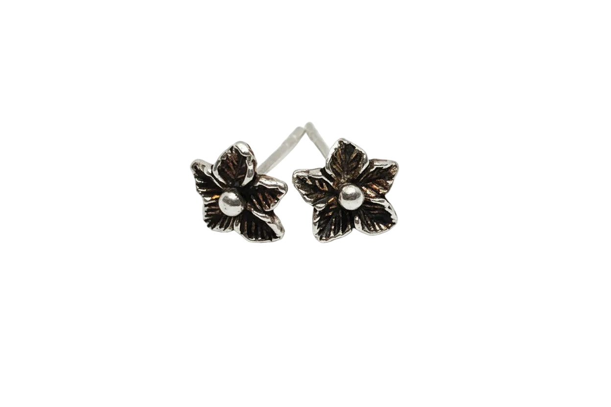 silver flower-shaped earrings