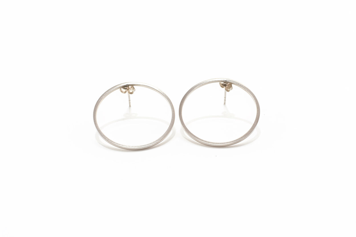 Silver hoop earrings with butterfly back