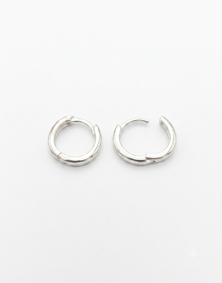 A pair of 925 Sterling Silver silver split hoop Huggies earrings 