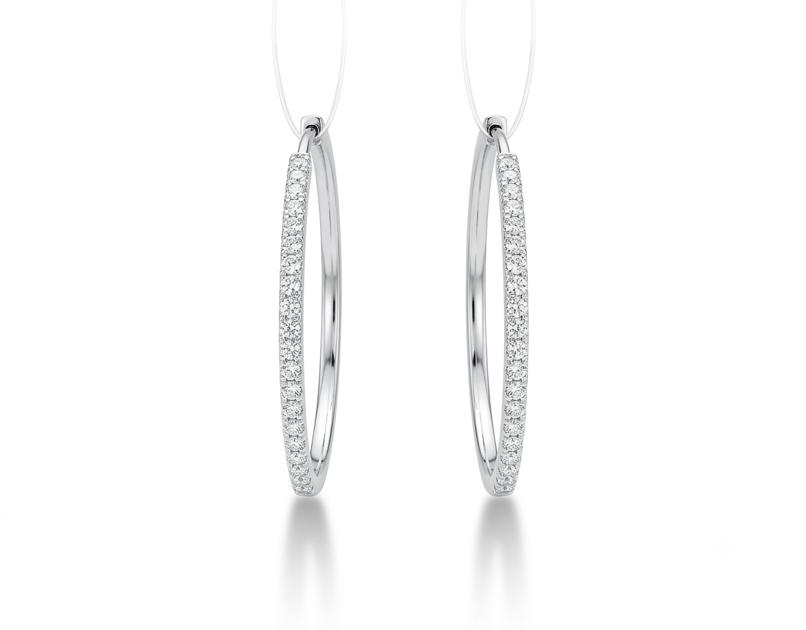 A pair of silver hoop earrings with pavé-set clear stones,