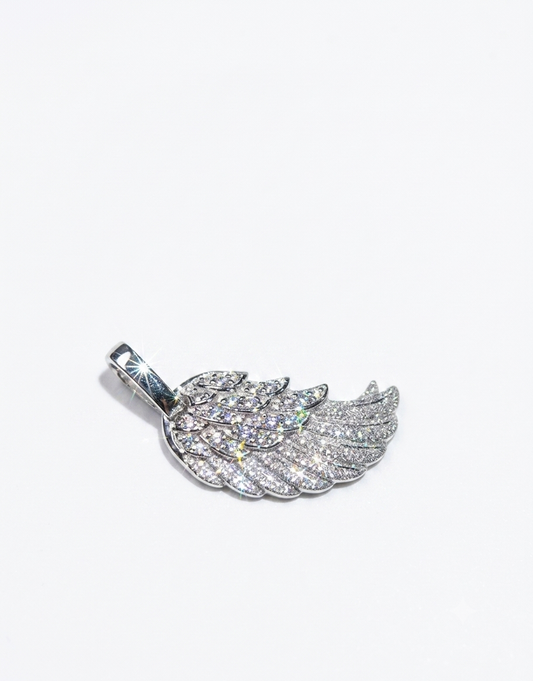 A silver-toned wing pendant encrusted with clear pavé stones,