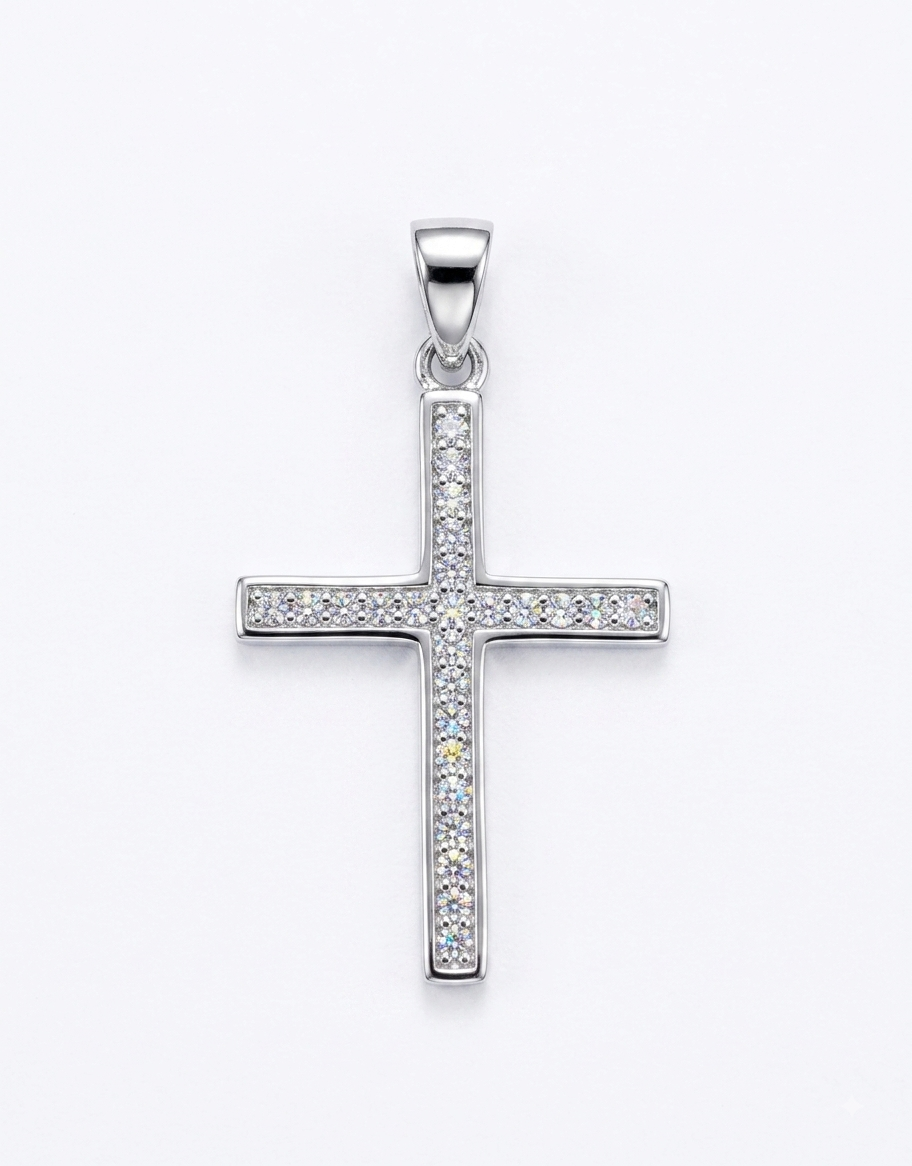 A silver cross pendant encrusted with small clear stones,