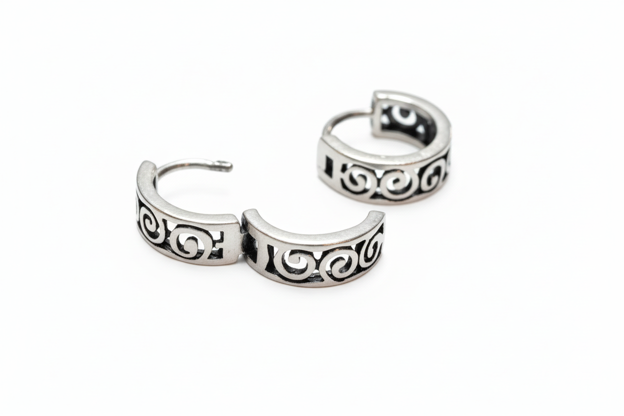 Pair of silver hoop earrings with intricate designs 